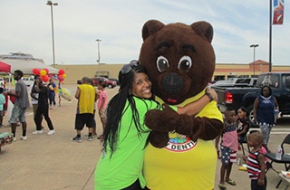 patient hugging cute bear mascot