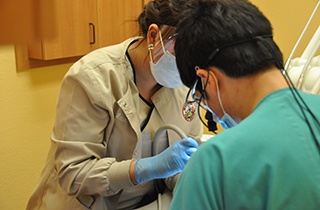 team members working on patient