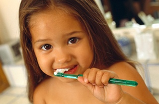 child with toothbrush