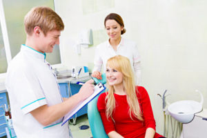 smiling woman in dental chair