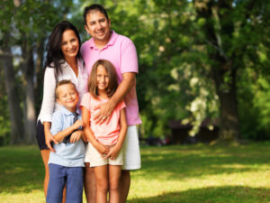 smiling family of four