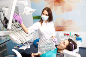 dentist showing adult patients x-rays