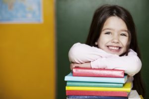 smiling girl with books