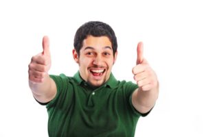 smiling man giving two thumbs up