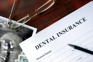 A dental insurance form on a table.