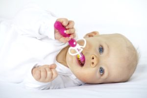 baby with toothbrush