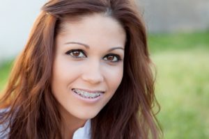 smiling woman with braces