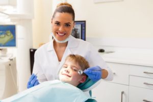 a young boy with a pediatric dentist