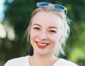 person with braces smiling