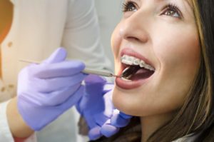 girl with braces at dental checkup