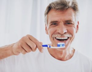 man about to brush his teeth