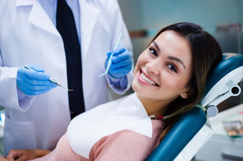 Woman smiling in dentist's treatment chair