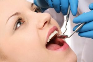 woman visiting dentist in far north Dallas