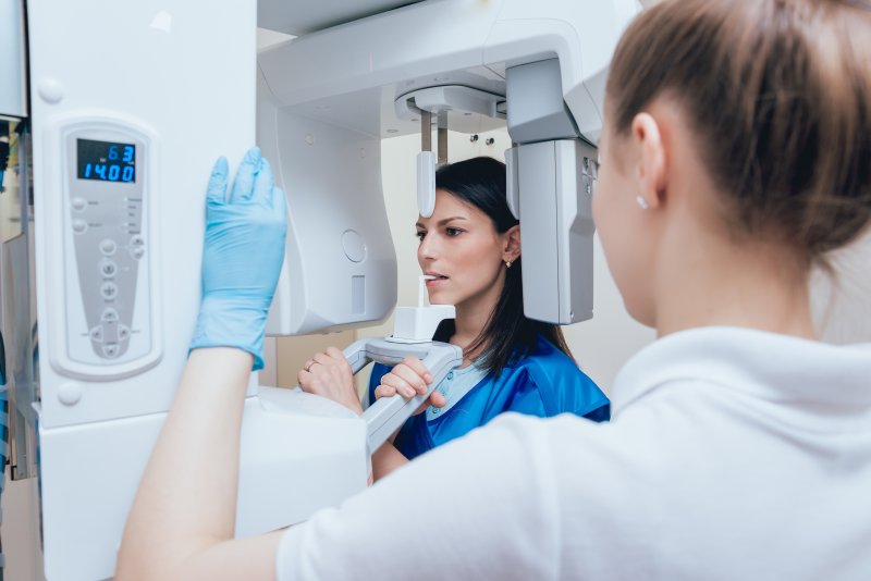 woman getting dental X-ray in Far North Dallas