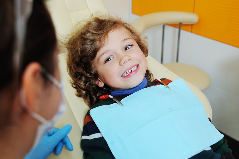 little boy learning about children's dentistry in Mesquite