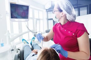 dentist using an intraoral camera 