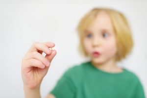 child with pulled tooth 