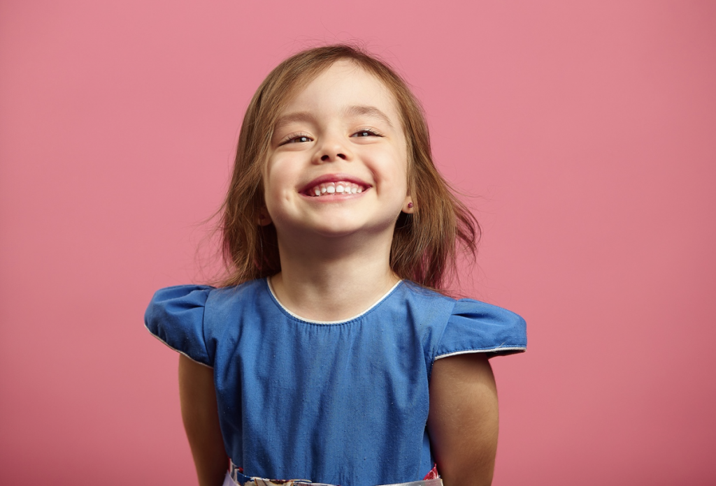  little girl smiling after seeing dentist in far north Dallas