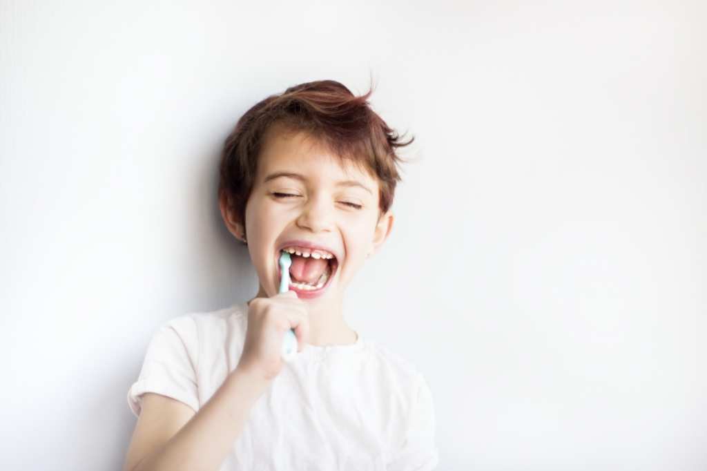 little boy brushing teeth 