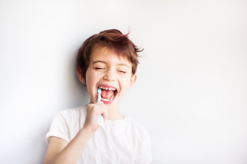 A child brushing his teeth