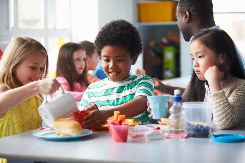 children eating lunch at school in Far North Dallas