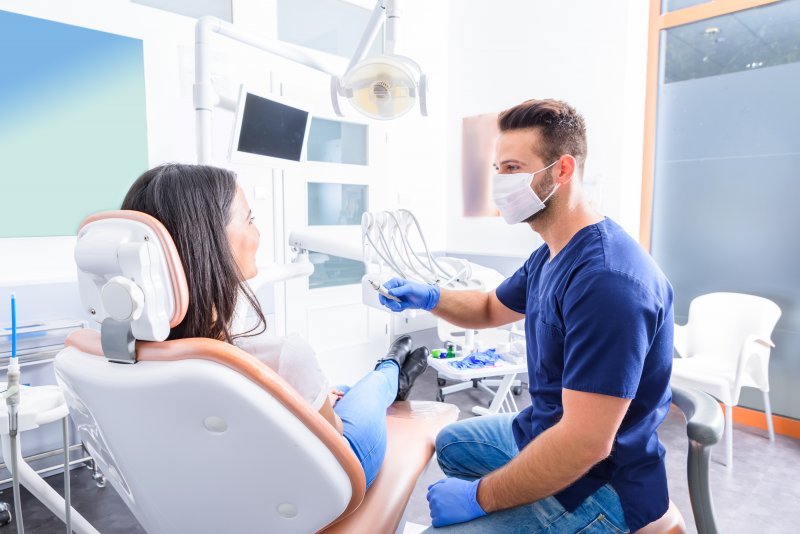 A dentist in love field treating a patient