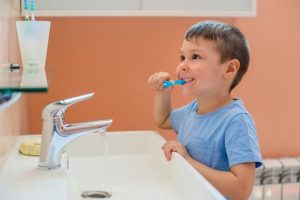 a child brushing his teeth during flu season in Duncanville