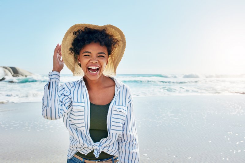 A smiling woman having fun on the beach