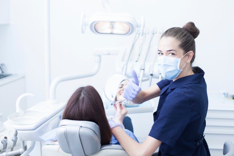 Dentist giving a thumbs up at an emergency dental appointment