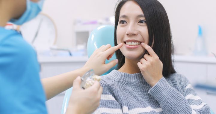A woman with a dental implant