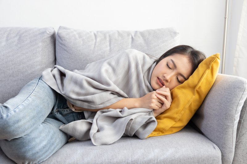 Lady rests on couch