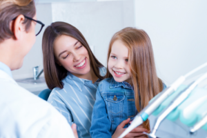 a child smiling during a dental visit