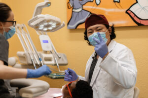 Dentist treating his patient
