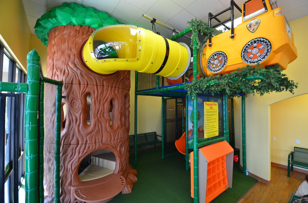A nature-themed play area in a dental practice