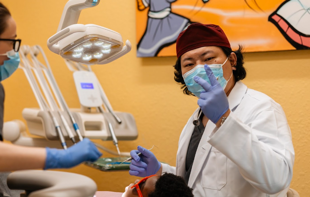 Dentist giving peace sign